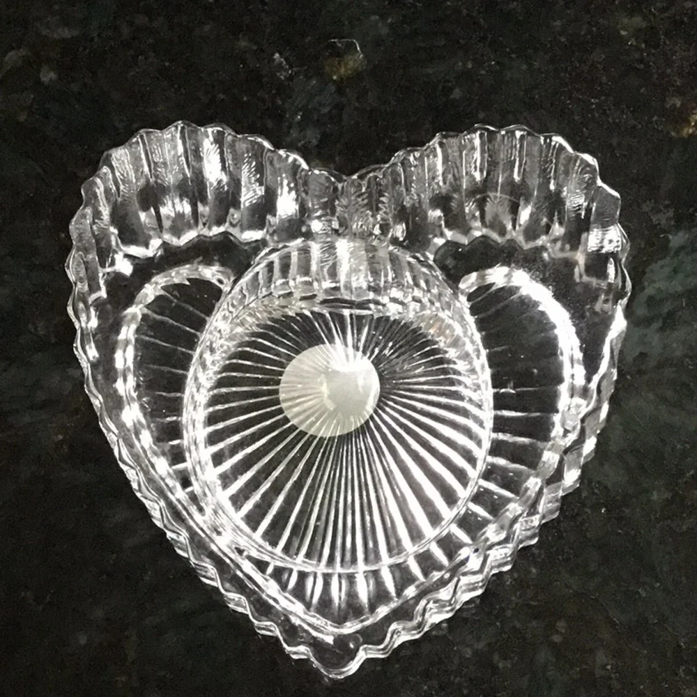 Lead crystal heart votive holder.